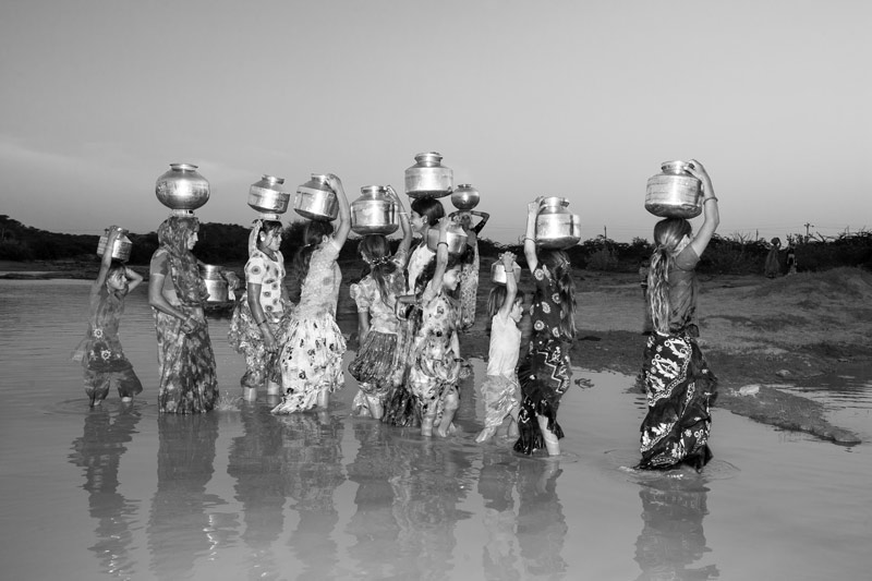Fetching 'sweet' water from a village pond in Kutch district, Gujarat